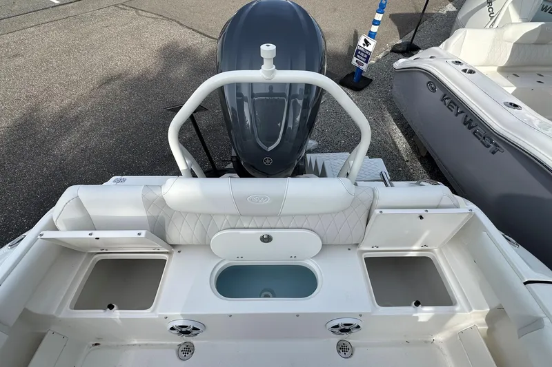 Slide: The Image of 2026 Key West 239 FSR boat interior with seating and storage compartments. - 8