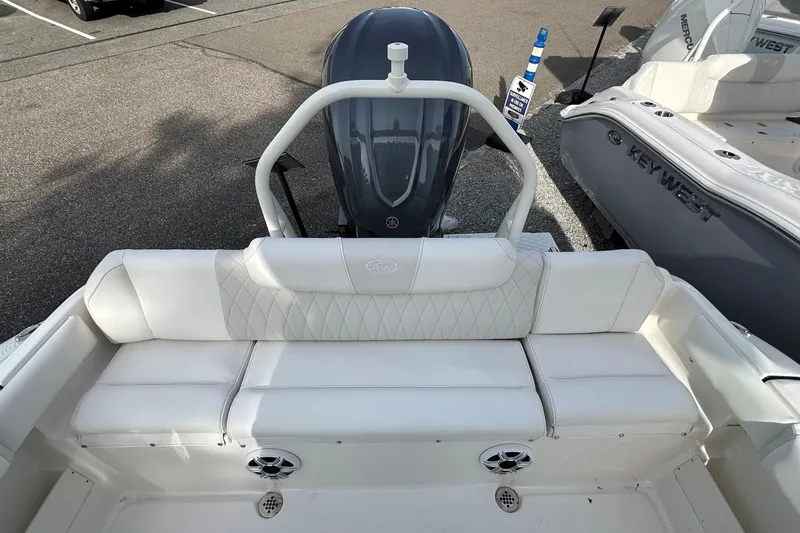 Slide: The Image of 2026 Key West 239 FSR boat with white seating and Yamaha outboard motor. - 9