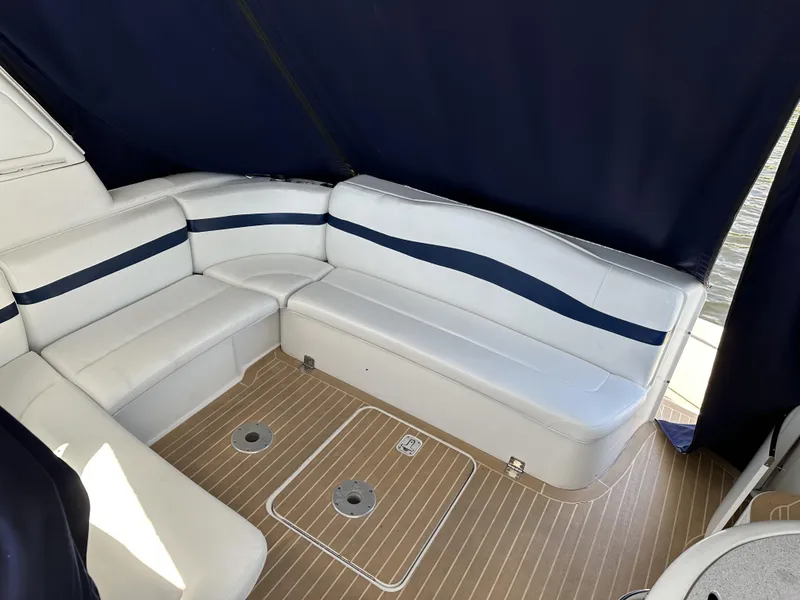 Slide: The Image of 2006 Formula 40 PC yacht interior with white and blue seating, wooden flooring. - 14