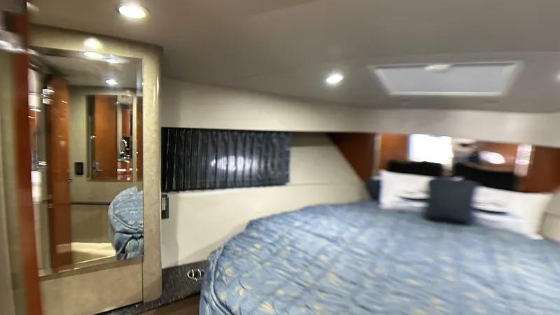 Slide: The Image of Luxurious interior of a 2006 Formula 40 PC yacht with a cozy bed and elegant decor. - 24