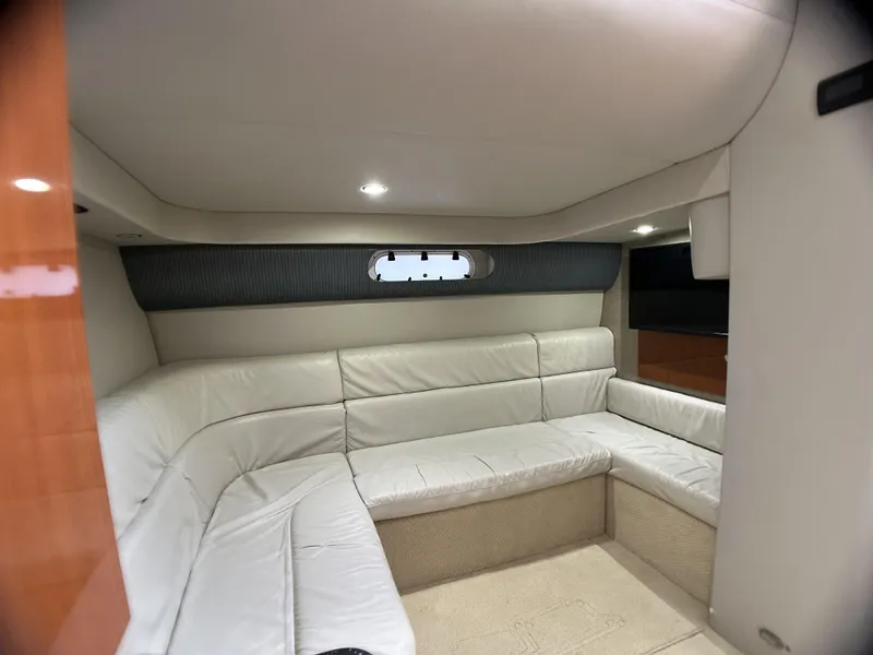 Slide: The Image of Interior of 2006 Formula 40 PC yacht with white leather seating and modern design. - 34