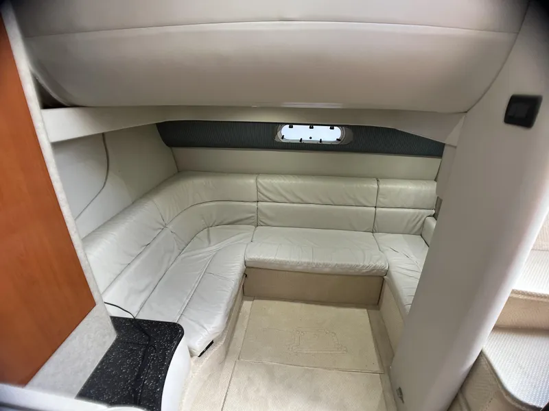 Slide: The Image of Interior of 2006 Formula 40 PC yacht with white leather seating and small window. - 35