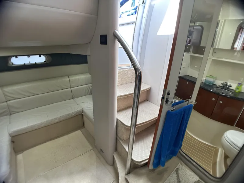 Slide: The Image of Interior of 2006 Formula 40 PC yacht with seating, stairs, and bathroom. - 36
