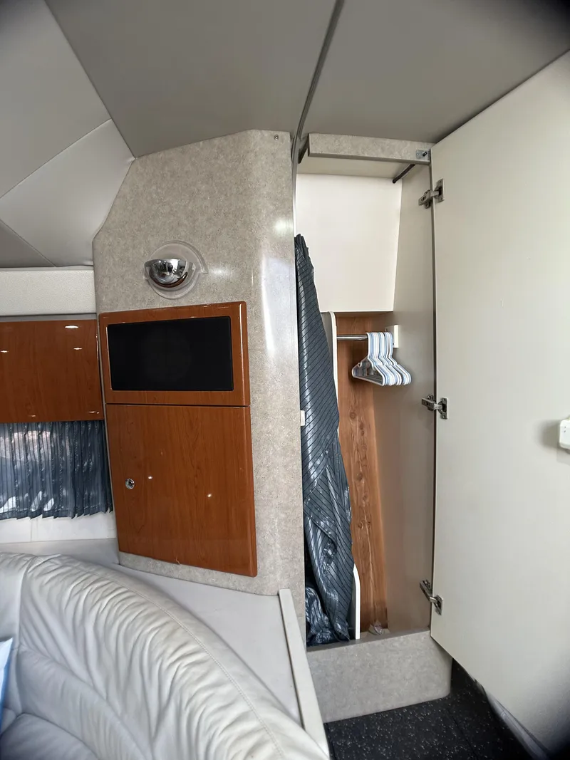 Slide: The Image of Interior of a 2006 Formula 40 PC yacht with closet and seating area. - 42