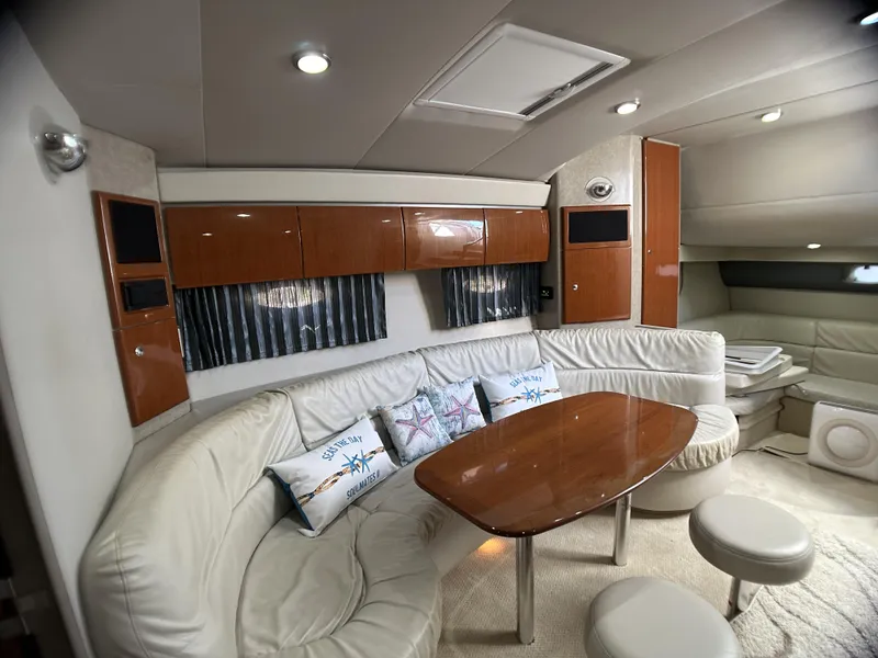 Slide: The Image of Luxurious interior of a 2006 Formula 40 PC yacht with plush seating and elegant wood finishes. - 48