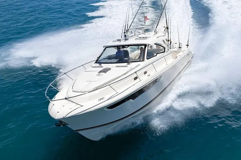 The Image of Manufacturer Provided Image: 2025 Pursuit OS 405 Offshore boat cruising on clear blue water. - 0