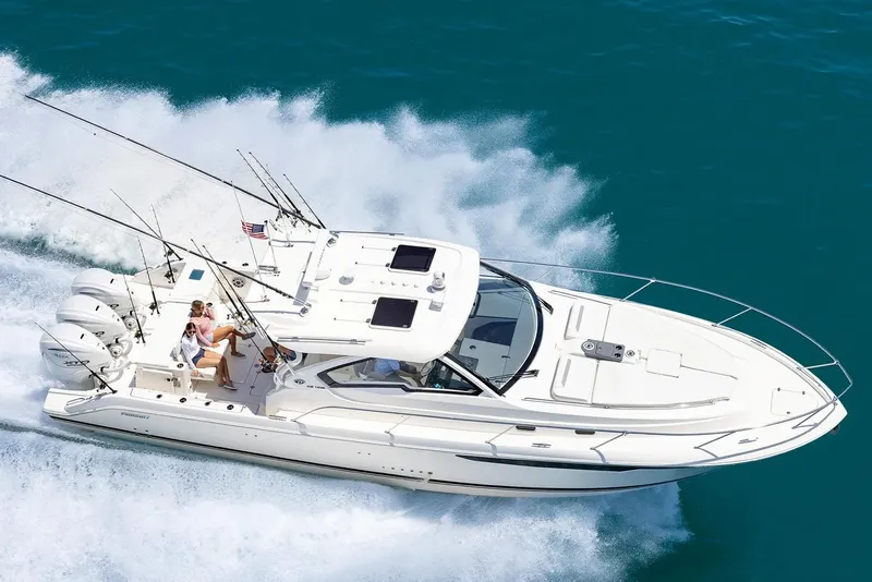 Slide: The Image of Manufacturer Provided Image: 2025 Pursuit OS 405 Offshore boat cruising on clear blue water. - 3
