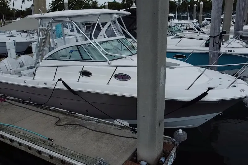 Slide: The Image of 2007 Robalo R305 Walkaround boat docked at marina, aerial view. - 10