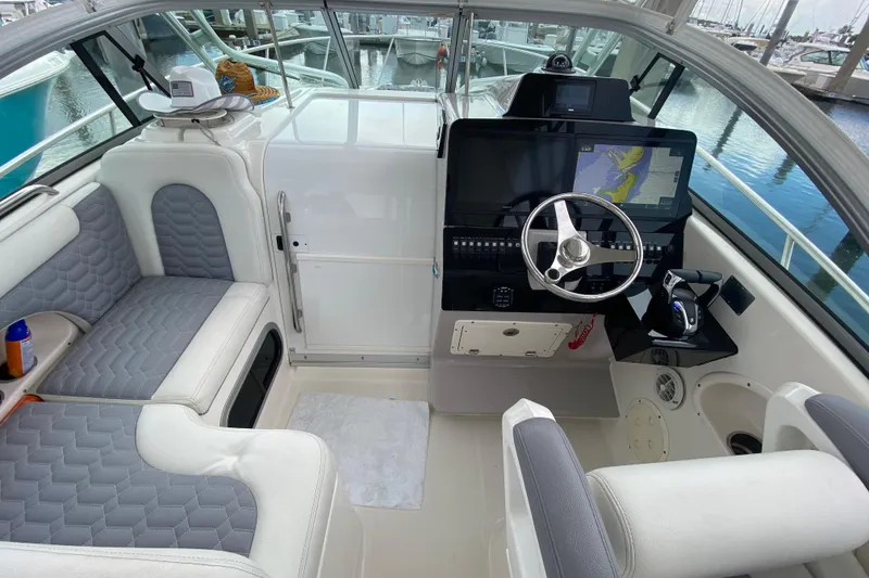 Slide: The Image of 2007 Robalo R305 Walkaround boat interior with Yamaha engines and nautical decor. - 21