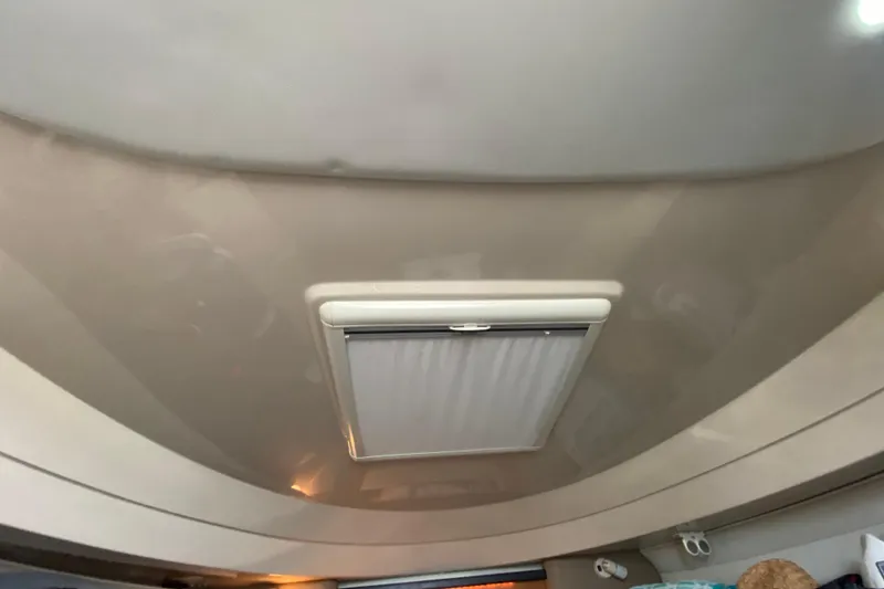 Slide: The Image of Interior of 2007 Robalo R305 Walkaround boat with cozy cabin and kitchenette. - 30