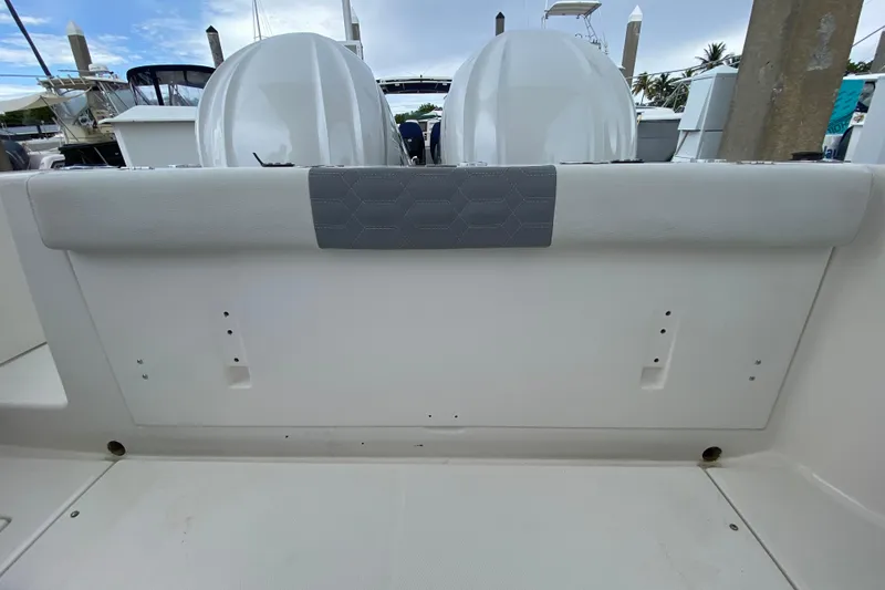 Slide: The Image of 2007 Robalo R305 Walkaround boat interior with sink, window, and storage cabinets. - 31