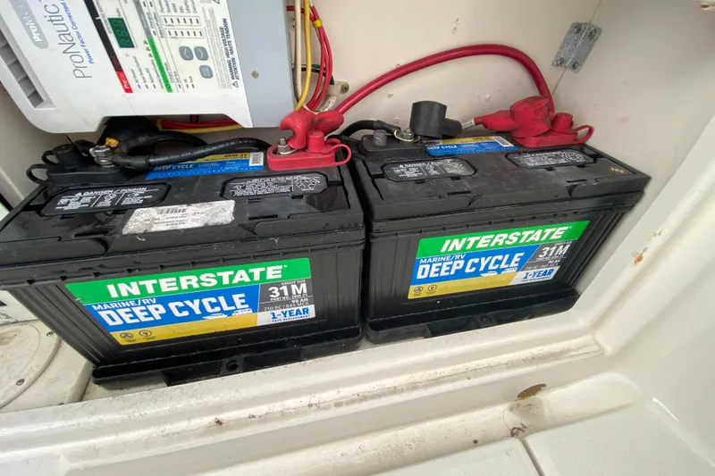 Slide: The Image of Twin Yamaha 300 V6 outboard engines on a 2007 Robalo R305 Walkaround boat. - 39