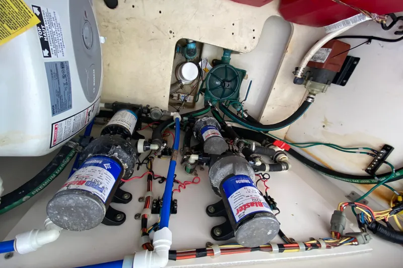 Slide: The Image of 2007 Robalo R305 Walkaround engine compartment with wiring, hoses, and components. - 43