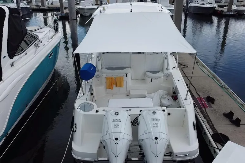 Slide: The Image of 2007 Robalo R305 Walkaround boat battery compartment with Interstate deep cycle batteries. - 45