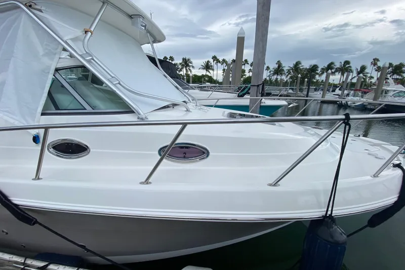 Slide: The Image of Overhead view of 2007 Robalo R305 Walkaround boat docked with twin engines. - 47