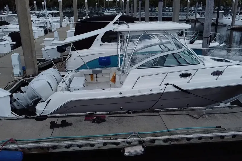 Slide: The Image of 2007 Robalo R305 Walkaround boat docked at marina, aerial view. - 5