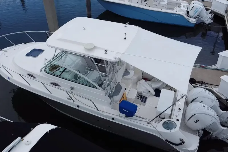 Slide: The Image of 2007 Robalo R305 Walkaround boat docked at marina, aerial view. - 7