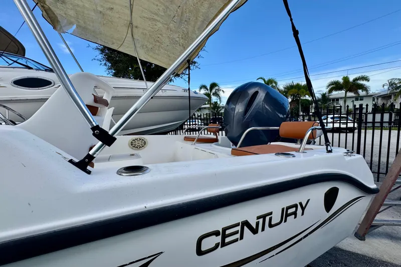 Slide: The Image of 2006 Century 1850 Mustang boat interior with seating and storage compartments. - 10