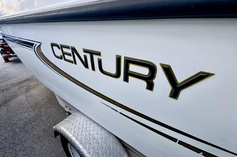 Slide: The Image of Steering console of a 2006 Century 1850 Mustang boat with gauges and controls. - 17