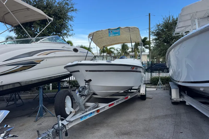 Slide: The Image of 2006 Century 1850 Mustang boat interior with seating and storage compartments. - 18