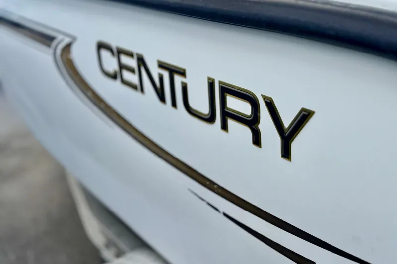 Slide: The Image of Interior of a 2006 Century 1850 Mustang boat with dual seats and steering console. - 21