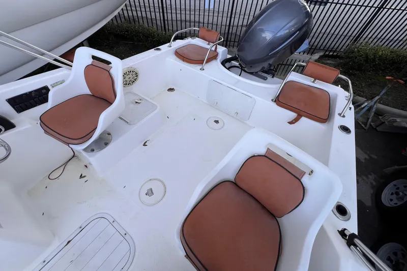 Slide: The Image of Steering console of a 2006 Century 1850 Mustang boat with gauges and controls. - 28