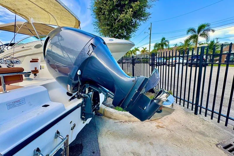 Slide: The Image of 2006 Century 1850 Mustang boat interior with brown cushioned seats and steering wheel. - 3