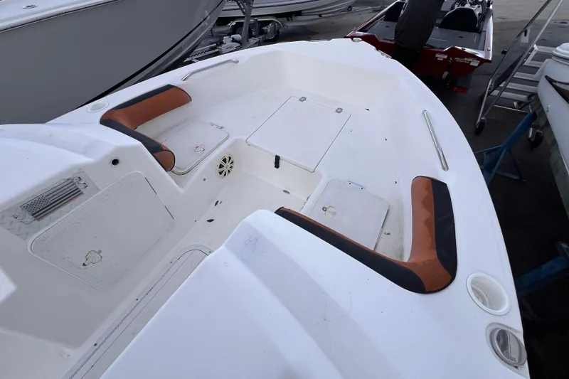 Slide: The Image of 2006 Century 1850 Mustang boat interior with steering wheel and brown seats. - 36
