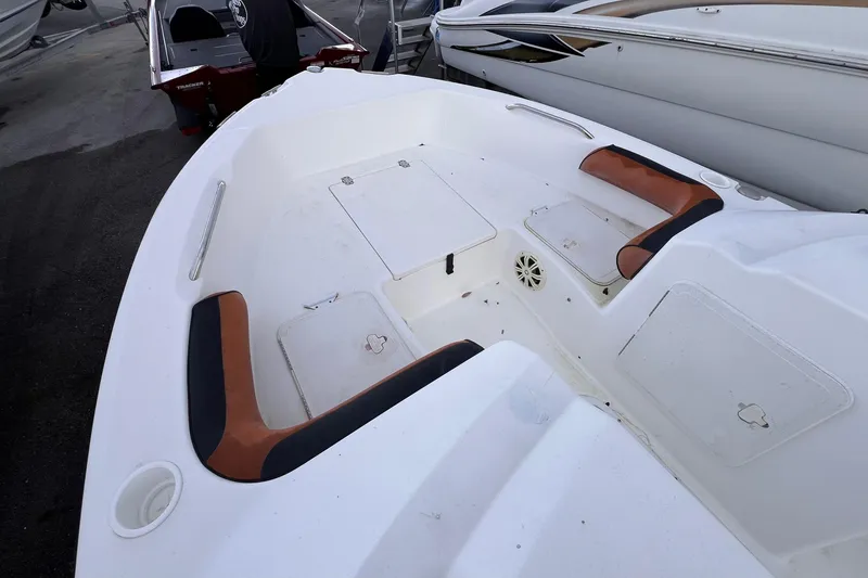 Slide: The Image of 2006 Century 1850 Mustang boat interior with control panel and seating area. - 41