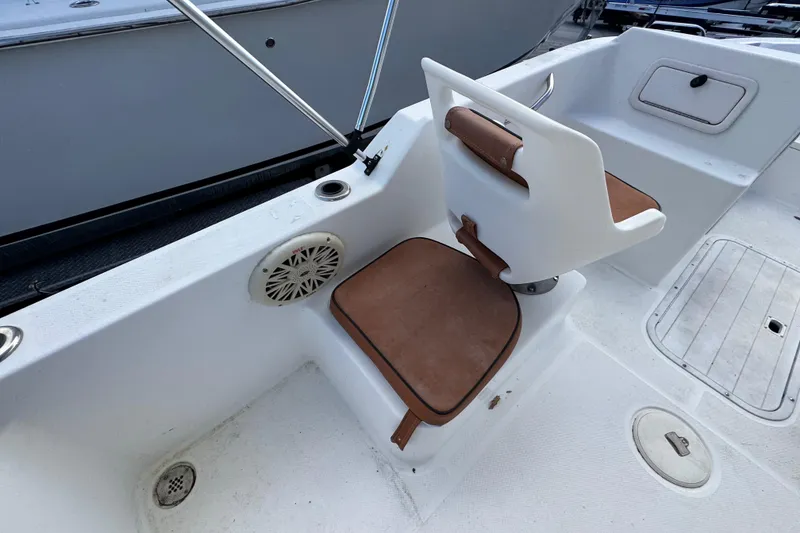 Slide: The Image of Rear view of a 2006 Century 1850 Mustang boat with propeller and ladder. - 43