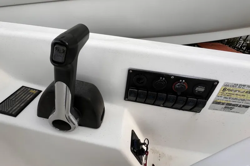 Slide: The Image of 2006 Century 1850 Mustang boat with powerful outboard motors docked outdoors. - 45