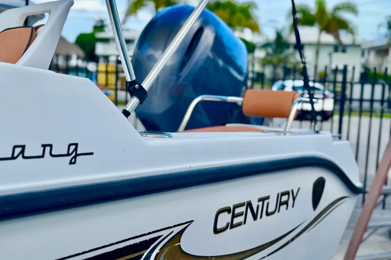 Slide: The Image of 2006 Century 1850 Mustang boat with spacious seating and sleek design. - 8