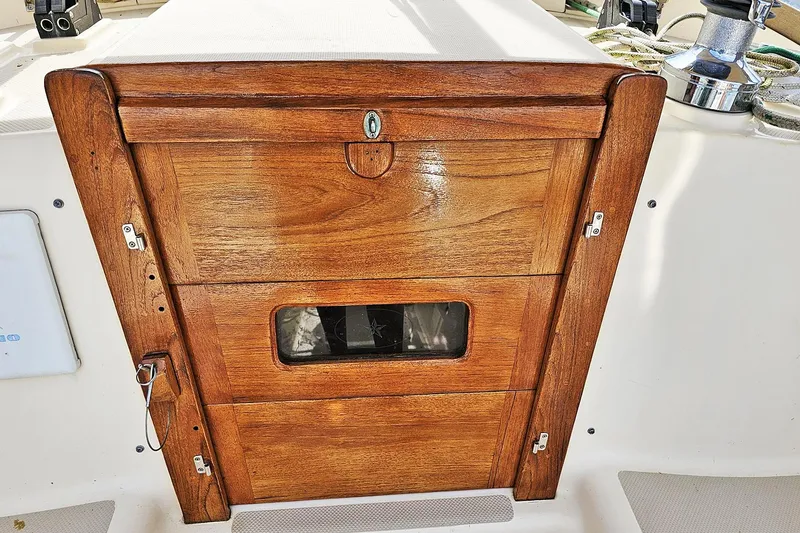 Slide: The Image of Wooden hatch door on a 2000 Island Packet 350 sailboat deck. - 18