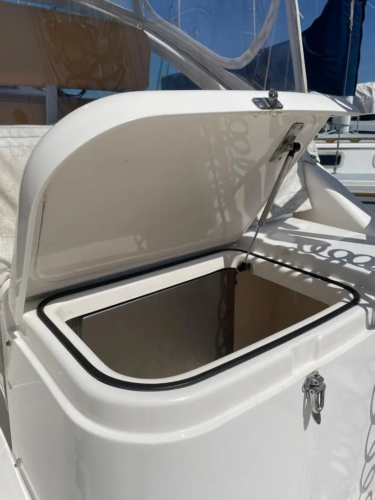 Slide: The Image of Open storage compartment on a 2004 Cabo 35 Express boat, showcasing interior space. - 14