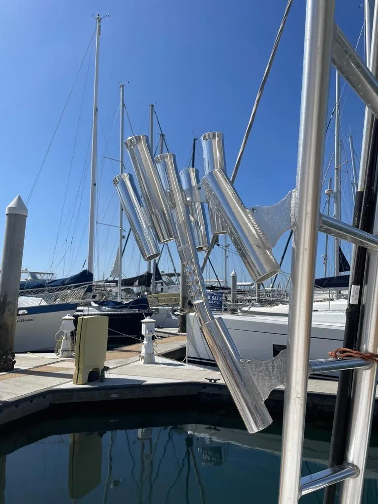 Slide: The Image of Marina view with sailboats and Cabo 35 Express fishing rod holders, 2004 model. - 15