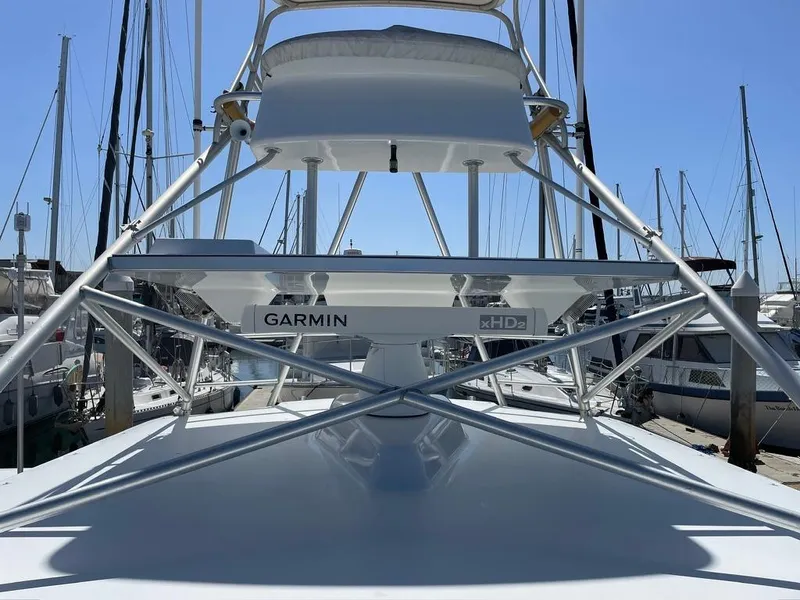 Slide: The Image of 2004 Cabo 35 Express boat with Garmin xHD2 radar, docked at a marina. - 22