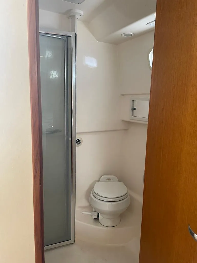 Slide: The Image of 2004 Cabo 35 Express boat bathroom with shower and toilet. - 40