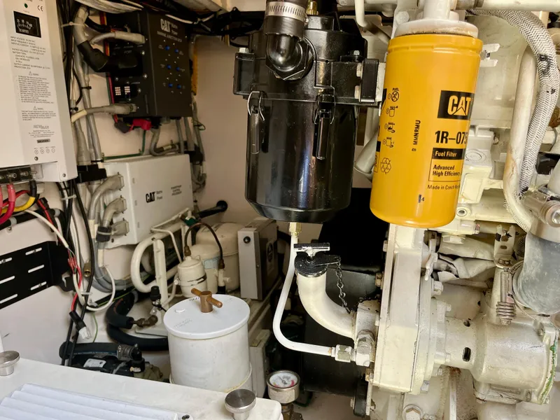 Slide: The Image of Engine room of a 2004 Cabo 35 Express with CAT fuel filter system. - 43