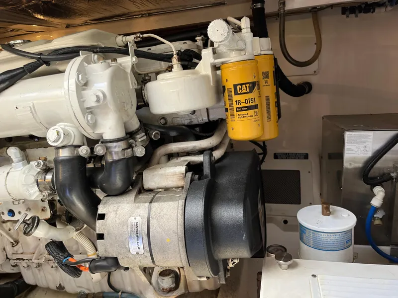 Slide: The Image of Engine compartment of a 2004 Cabo 35 Express with CAT fuel filter visible. - 44