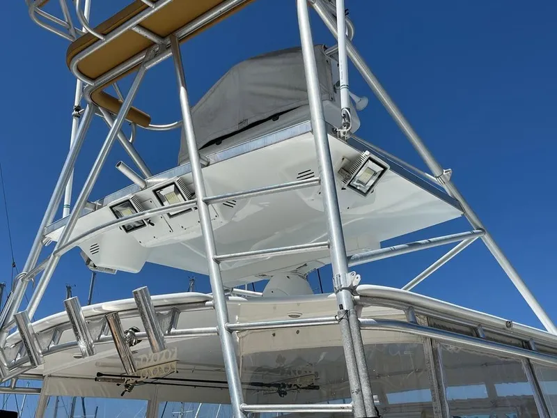 Slide: The Image of Tower structure of a 2004 Cabo 35 Express boat against a clear blue sky. - 7