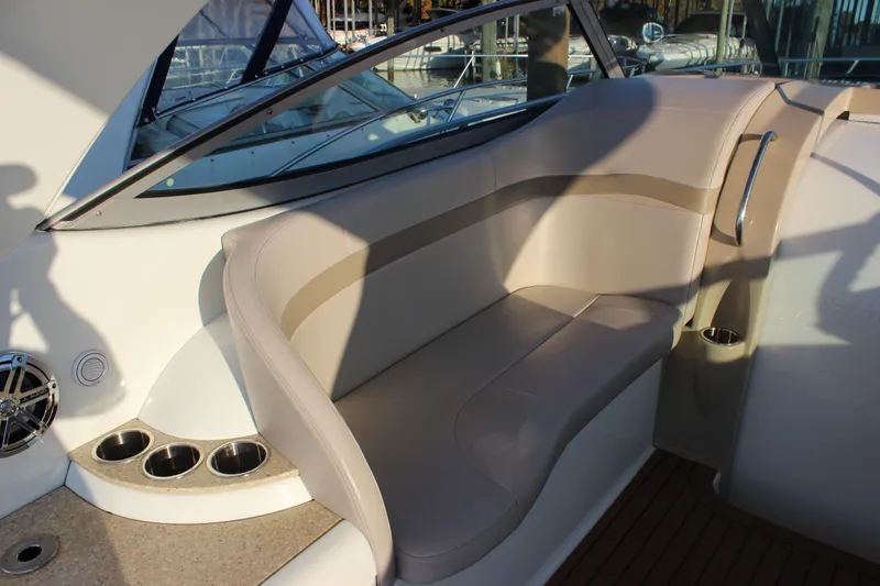 Slide: The Image of 2008 Formula 34 Performance Cruiser interior seating with cup holders and sleek design. - 11