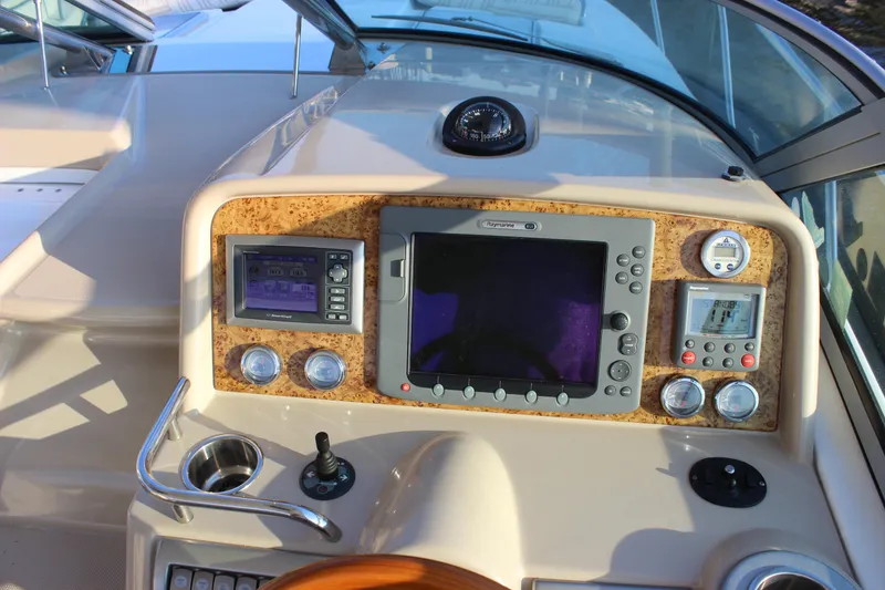 Slide: The Image of Control panel of a 2008 Formula 34 Performance Cruiser with navigation and monitoring systems. - 12