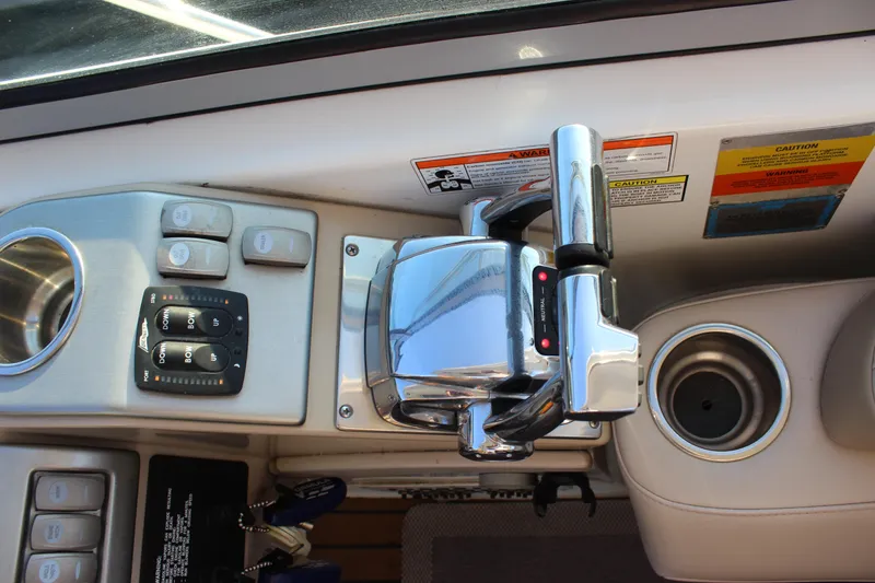 Slide: The Image of Control panel of a 2008 Formula 34 Performance Cruiser with throttle and switches. - 14