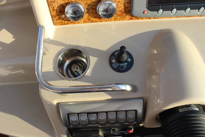 Slide: The Image of Control panel of a 2008 Formula 34 Performance Cruiser with joystick and gauges. - 15