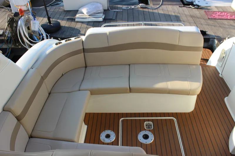 Slide: The Image of 2008 Formula 34 Performance Cruiser interior with beige seating and teak flooring. - 16