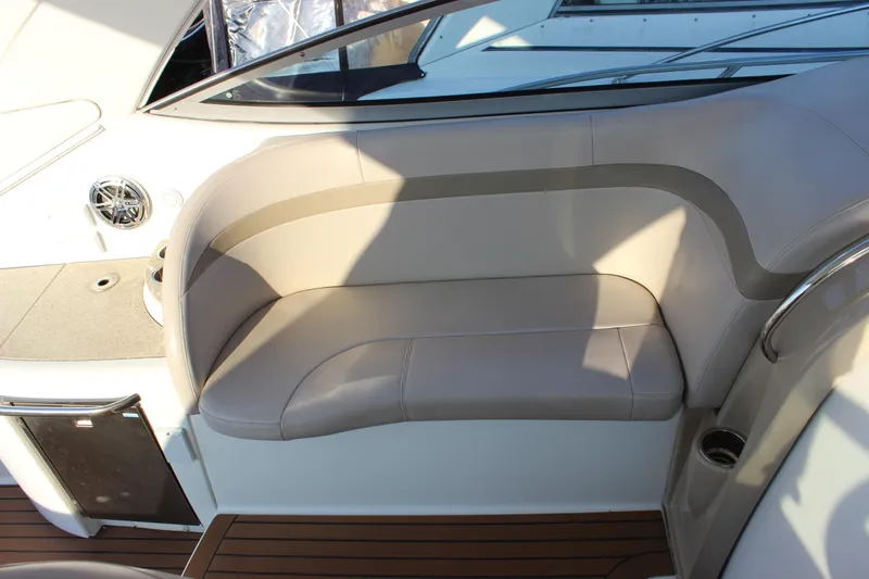 Slide: The Image of 2008 Formula 34 Performance Cruiser interior seating with beige upholstery and wood flooring. - 18