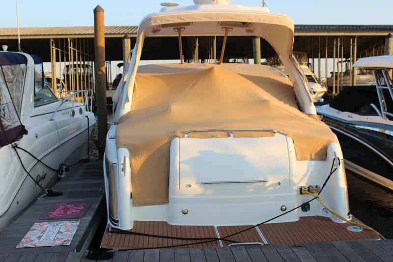 Slide: The Image of 2008 Formula 34 Performance Cruiser docked with protective cover, rear view. - 2