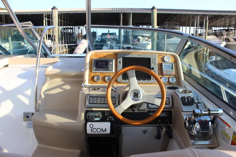 Slide: The Image of 2008 Formula 34 Performance Cruiser helm with wood accents and modern navigation equipment. - 21