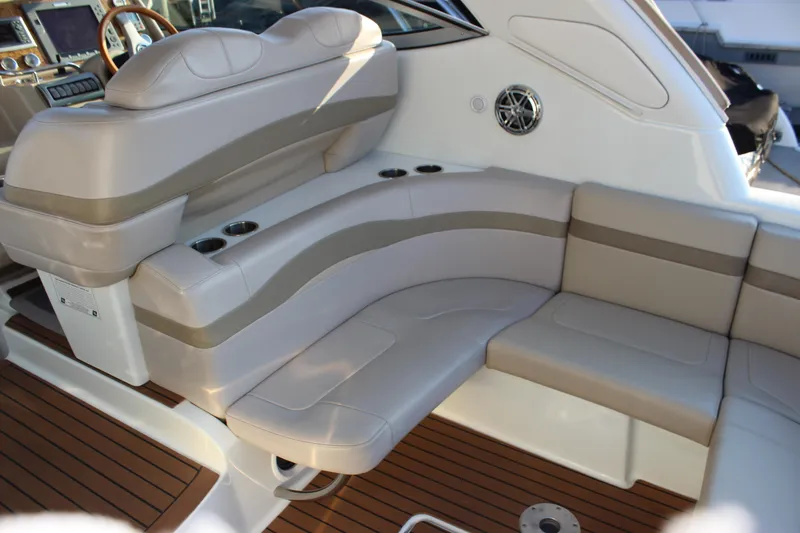Slide: The Image of 2008 Formula 34 Performance Cruiser interior with beige seating and wood flooring. - 23