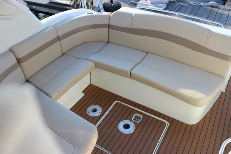 Slide: The Image of 2008 Formula 34 Performance Cruiser interior with beige seating and teak flooring. - 26